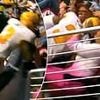 Dangerous moment football player crashes into fan after leaping over barrier to make crucial touchdown