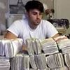 Jailed Albanian heroin dealer who kept photo of himself posing with £250,000 in cash is allowed to stay in the UK