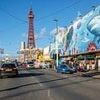 Woman is arrested over 'attempted abduction' after baby in pram 'snatched in front of parent' at seaside hotspot