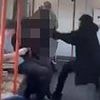 Moment schoolboy is 'beaten up by man on train' as terrified passengers watch on - then move away