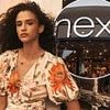 Next hikes annual profit forecast as warm weather and turmoil at M&S boost sales