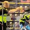 Moment 'thief' is pepper sprayed by police after smashing bottles as he tried to flee Tesco supermarket