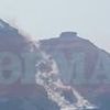 Moment massive landslide crashes into the sea in Santorini engulfing village with dust as tourists watch on - six months after holiday island was rattled by earthquakes