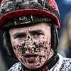 Jockey rushed to hospital and racing delayed after 'nasty' parade ring incident at Punchestown