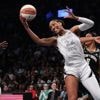 New York wins opener against Las Vegas 92-78 after celebrating 2024 title with ring, banner ceremony