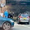 Railings installed to protect pedestrians near 'killer kerb' are already 'mangled'... as motorists hit them as well