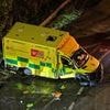 Two paramedics are rushed to hospital after car 'fleeing police' ploughed into ambulance: Teenager is charged