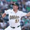 Rooker hits 2-run HR, Miller strikes out 2 with runner on 2nd in 9th as Athletics beat Blue Jays 4-3