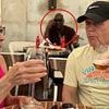 Incredible moment family realize all-time sporting great is casually sitting behind them in vacation photos