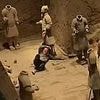 Shocking moment tourist jumps into Terracotta Army clay warriors and damages statues before being overpowered by security guards