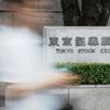 Asian shares are mixed after Wall Street closes higher and edges to more records