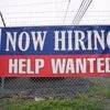 Fewer Americans sought unemployment benefits last week as layoffs remain low