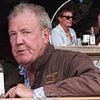 Jeremy Clarkson checks out the competition! Star samples a Britpop lager as he takes a break from his Cotswolds farm duties to enjoy Blur star Alex James' local festival