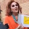 Drag queen who had to be escorted by police from children's story telling event condemns protesters and threatens to sue after being barraged by abuse online