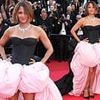 Halle Berry flouts the Cannes Film Festival's strict new dress code as she hits the red carpet in a voluminous black-and-pink gown at Mission: Impossible premiere