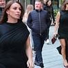 Coleen Rooney cuts a glamorous figure in a leggy black dress as she enjoys a night out in Manchester with husband Wayne