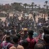 Photos show Palestinians pursuing food aid after the latest air drops in Gaza