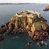 'It looks like Alcatraz!': Holidaymakers blast tech tycoon's holiday island off coast of Wales after he puts it on market for £3m… and there are TWO big catches that might put buyers off