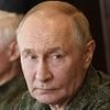 Putin dons his military fatigues to visit Zapad war games 500miles from the frontline - while his troops blow up blocks of flats in Kharkiv