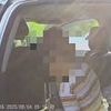 Moment sweat-drenched child is rescued from sweltering Utah car while mother was taking driving test
