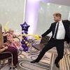 Prince Harry sword fights with children at WellChild awards after paying visit to late Queen's grave in Windsor while William and Kate were at official engagement just seven miles away