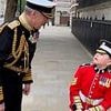 Adorable moment boy dressed in British Army costume has chance run-in with VERY high profile admiral