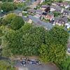 Protest as 200-year-old oak trees face chop to save house built in 1980s... with villagers accusing insurance giant of 'eco-terrorism'