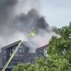 Walthamstow fire: Huge blaze erupts at tower block with 100 firefighters scrambled as black smoke billows into sky