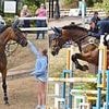 Zara Tindall competes at The Hartpury International Horse Trials as daughter Mia, 10, watches her in action
