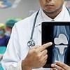NHS launches review after more than 10,000 knee replacement patients were fitted with a potentially faulty implant that left many immobile and addicted to painkillers