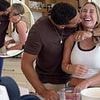 Kate Ferdinand blushes as husband Rio kisses her in the kitchen of their £4million mansion after being 'egged on by the big kids'