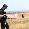 Man killed on Isle of Sheppey 'was hit over the head with a concrete slab': Girl, 16, and two boys, 14 and 15, are arrested after holidaymaker heard shouts of 'I've done him'