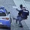 Moment swaggering robbery suspect is brutally taken down by cop after punching police car