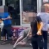 Moment crazy swordfight breaks out outside kebab shop before police rush in to arrest seven