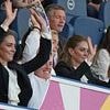Kate Middleton shows her fun side as she takes part in a Mexican wave and enthusiastically cheers on the women's rugby team during World Cup match