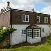 Village take on couple who bought 15-century cottage with a 'verbal agreement that it would be their forever home'... but will now bulldoze it for new-build homes