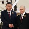 What Putin's body language really says about his relationship with President Xi, according to expert - as Russian despot meets Chinese premier at Victory Parade