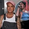 Robbie Williams, 51, reprises iconic dungarees from his Take That heyday at new album Q&A as he admits he's battling with his hair which is 'thinning everyday'
