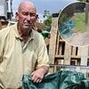 Furious builder is fined £500 by council busybody for flytipping after he left two empty sacks on grass verge while renovating house