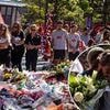 Diogo Jota's wife and team-mates arrive at Anfield to witness fans' incredible tribute and lay flowers for Liverpool star