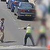 Moment hero police officer tackles knifeman in the street amid brawl after she spotted blade in his hand