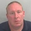 Neighbour-from-hell businessman who waged war on the couple next door during two-year campaign where he sprayed water at them and even damaged their bird house is handed restraining order