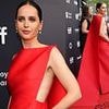 Felicity Jones oozes glamour in a scarlet floor-length gown as she graces the red carpet at the Train Dreams premiere during the Toronto Film Festival