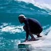 Meghan shares new video of Prince Harry surfing - with Nineties rap track celebrating him as 'what a mighty mighty good man'
