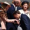 Awkward moment Emmanuel Macron air kisses the Princess of Wales' hand after being snubbed by wife Brigitte