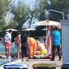 Moment horrified tourists desperately provide first aid after famed daredevil Felix Baumgartner fatally crashed his paraglider into Italian swimming pool packed with children
