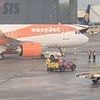 Easyjet plane is grounded as rescue crews rush to help holidaymakers in 'collision' at Manchester Airport