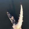 North Korea's Kim watches missile test-firings from country's first destroyer