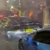 Moment yobs block off London street with fleet of supercars and set off fireworks in the middle of the road at midnight during 'wedding celebration'
