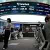 Asian shares mostly lower, trading in a narrow range with US markets closed for Memorial Day